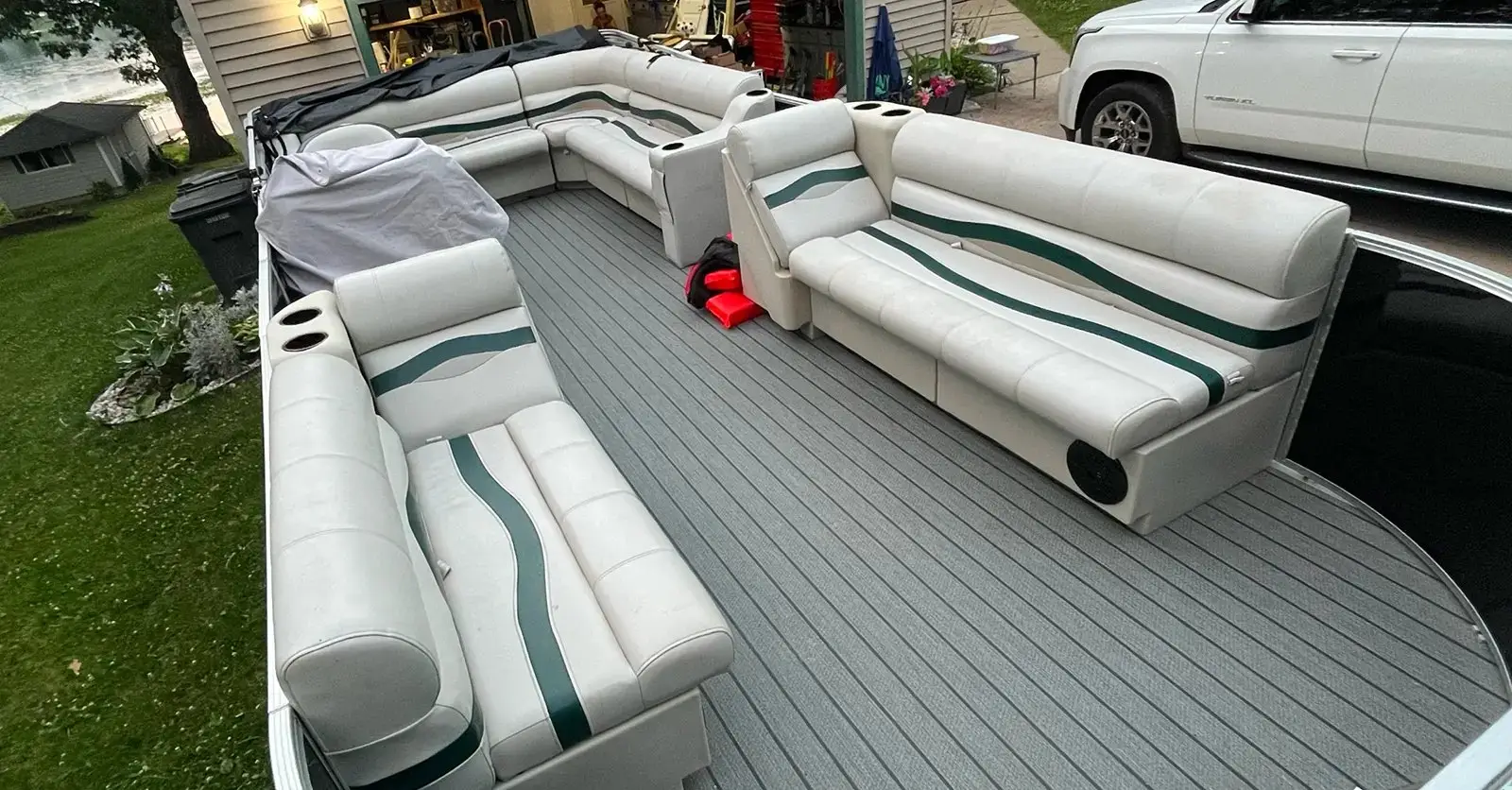 Comparing rectangular bench seats and curved radius corner lounges on a pontoon boat.